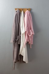 Fototapeta premium Bathrobes hanging on hook
