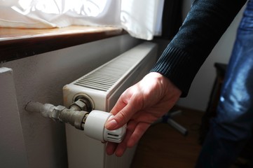 The valve of a home radiator adjusting the temperature in the room