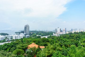 Obraz premium POV from singapore cable car, aerial view of singapore city near harbour with blue sky and cloud.
