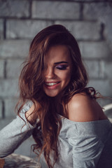 Obraz premium Portrait of a sexy woman with makeup and beautiful hair.