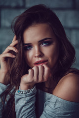 Fototapeta premium Portrait of a sexy woman with makeup and beautiful hair.