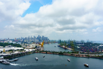 panorama landscape view of commercial port of singapore with cloudy sky. very busy port and important for logistic and transportation in asia. transportation concept.