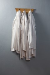 Laboratory coat hanging on hook