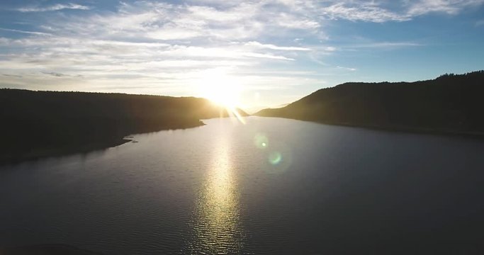 Flying Above a Mountain Lake at Sunset 03