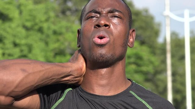 Muscular African Male Athlete And Soreness