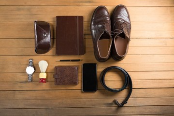 Various accessories arranged on wooden plank