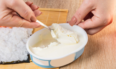 Chef prepares rolls, hands closeup