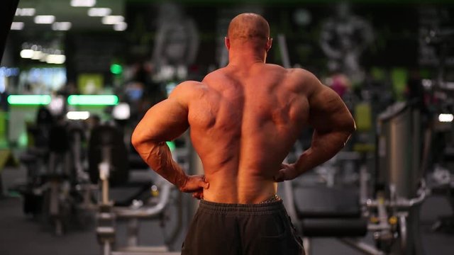 bodybuilder posing in a gym