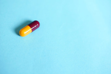 Capsule Over Blue Background