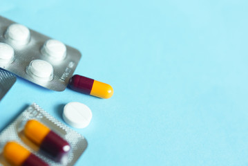 Capsule And Pills Over Blue Background