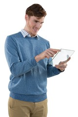 Male executive using glass digital tablet