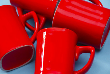 Red Mug Over Blue Background