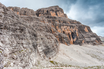 Fototapeta premium Vertical and majestic western side of Tofana di Rozes Peak, Travenanzes Valley, Dolomites, Italy