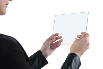 Businesswoman using glass digital tablet
