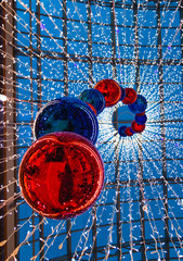 several large bright red Christmas balls hanging at the Mall