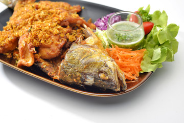 Sea Fish Fried with garlic and pepper eat together with Thai Seafood Sauce