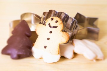 Christmas cookie molds on wooden table and christmas cookies