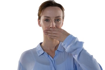 Female executive covering her mouth