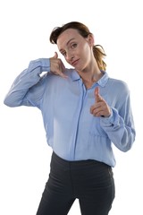 Female executive gesturing against white background