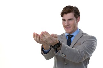 Businessman pretending to hold an invisible object