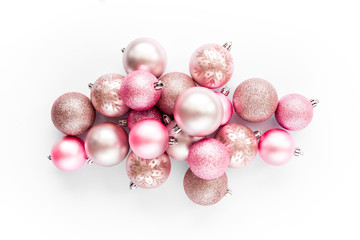 Christmas decoration: pink glass christmas balls on white background. flat lay, top view