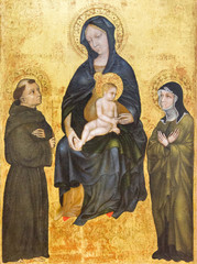 Pavia, Italy. November 11 2017. The painting of Madonna with the infant Jesus among Saint Francis of Assisi and Saint Clare. End of XIV  century. From the convent "Santa Chiara la Reale" in Pavia.