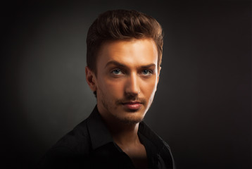 Fototapeta premium Young man's portrait. Close-up face.