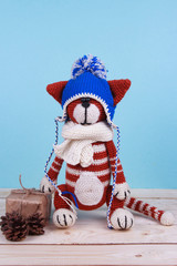 little redcat toy crochet handmade blue background