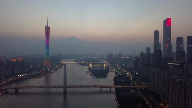 sunset illuminated guangzhou city downtown canton tower river bridge aerial panorama 4k china
