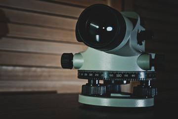 Optical level on the table in anticipation of construction works