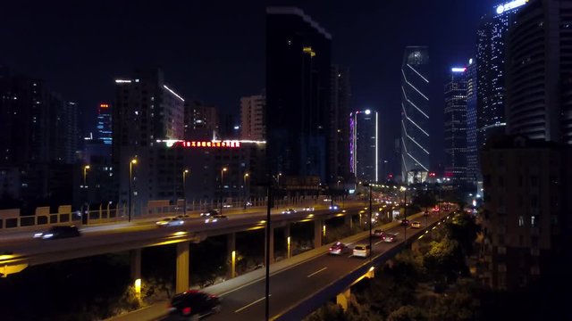 night time illuminated guangzhou downtown traffic road junction aerial panorama 4k china
