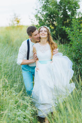 the bride and groom are photographed on the nature