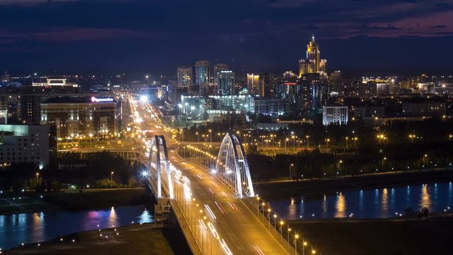 Evening timelapse above the Bridge with the transport and clouds on the background. Central Asia, Kazakhstan, Astana