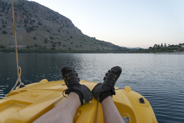 A view of the lake with catamarans in close-up. The turquoise water.