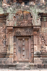 Fototapeta na wymiar Banteay Srei, a 10th century Hindu temple dedicated to Shiva. The temple built in red sandstone was forgotten for centuries and rediscovered 1814 in the jungle of the Angkor area of Cambodia. 