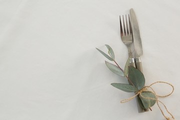 Fork and butter knife tied with leaf 