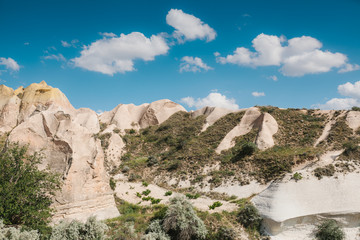 Fototapeta na wymiar Beautiful view of the hills of Cappadocia. One of the sights of Turkey. Tourism, travel, beautiful landscapes, nature.