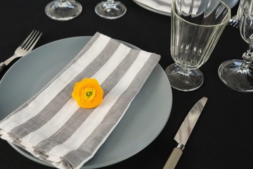 Beautiful table setting with floral arrangement 