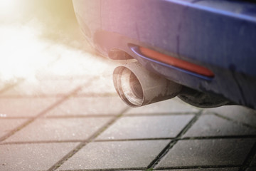 Car exhaust pipe system air pollution of traffic fumes. 