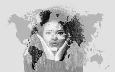 Double exposure of lovely woman giving kiss and world map, monochrome
