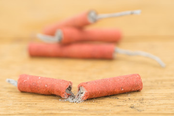 Red Firecrackers on wooden background