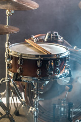 musical instruments drum kit, flash of light, a beautiful light in the background with copy space