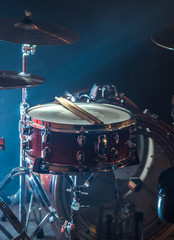 musical instruments drum kit, flash of light, a beautiful light in the background with copy space