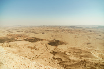 Fototapeta na wymiar Summer negev desert in Israel. Crater ramon full of sand mountains