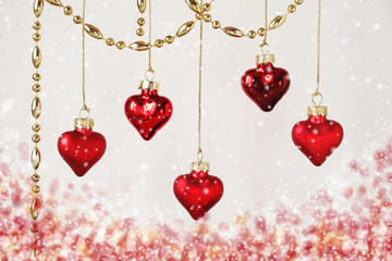 Red hearts Christmas decorations on background