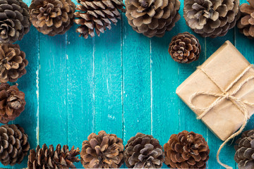  frame of cones on blue wooden table and box with gift