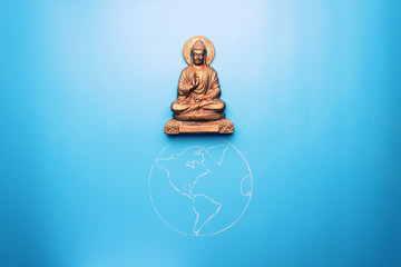 buddha statuette on the earth