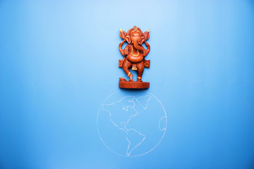 Fototapeta premium ganesha statuette on the earth