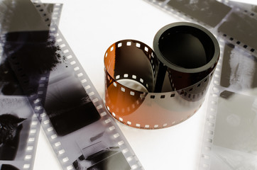 the roller 35 mm film on white background, black and white negatives