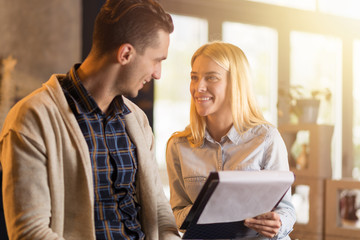 Smiling businesswoman cooperating with her male colleague.